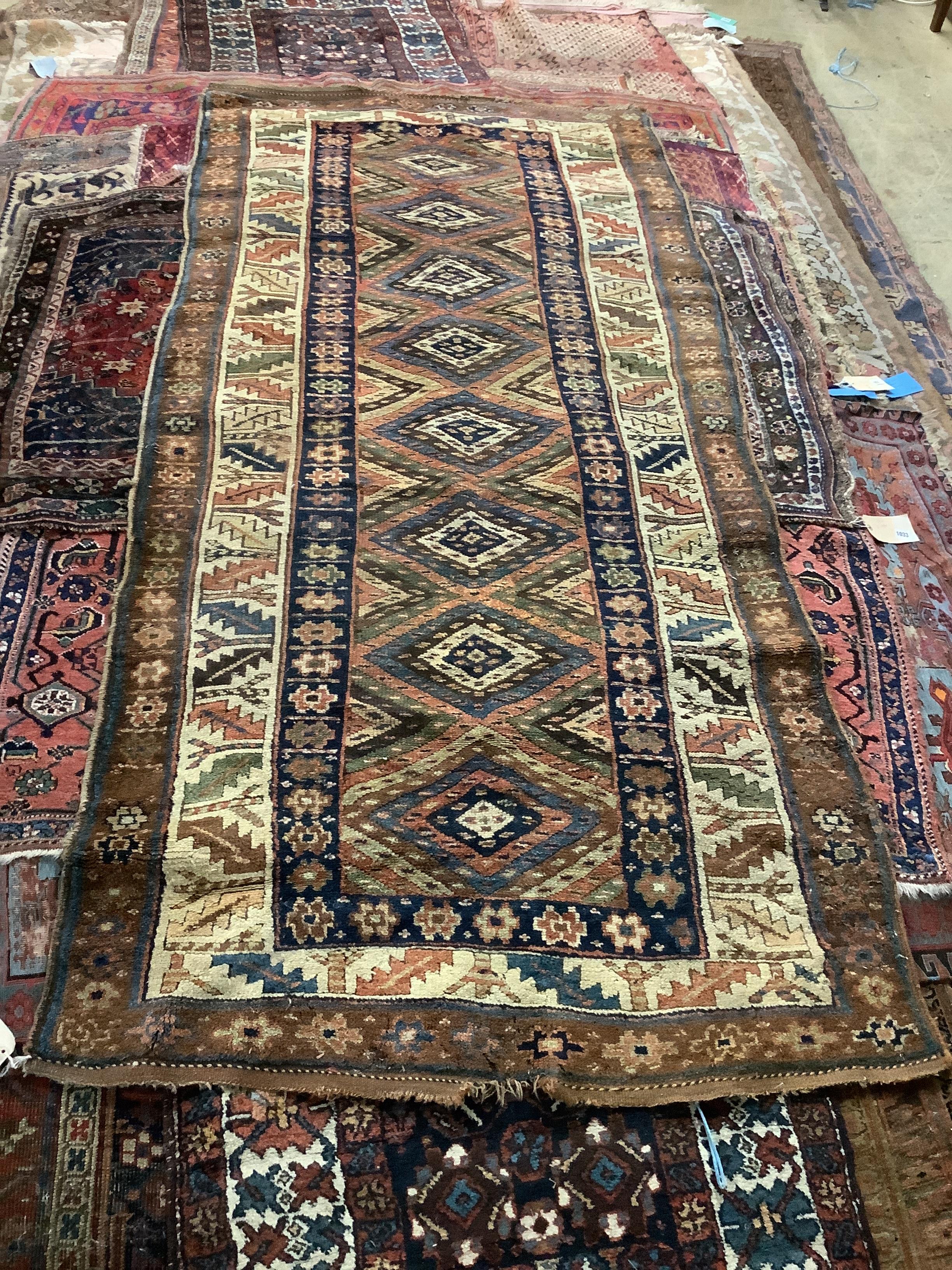 An antique Kurdistan rug, 261 x 119cm